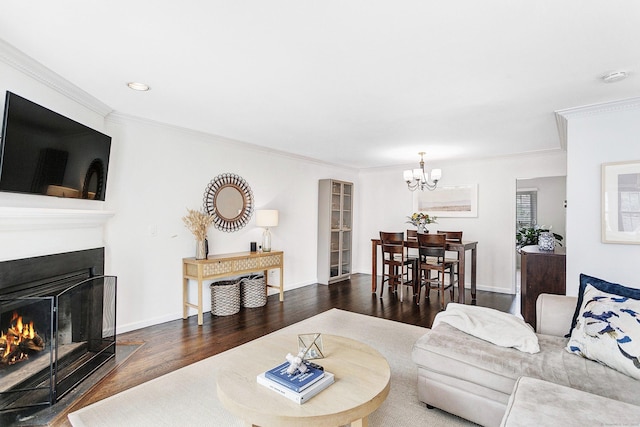 118 Grove St Apt 7, Stamford, CT 06901 - living room featuring wood finished floors, a chandelier, ornamental molding, recessed lighting, and a warm lit fireplace
