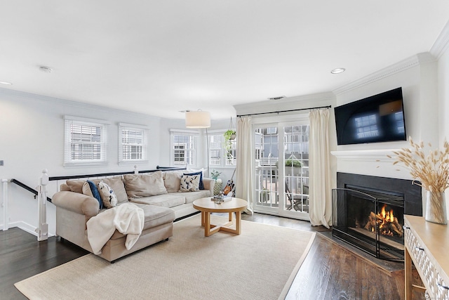 118 Grove St Apt 7, Stamford, CT 06901 - living area featuring crown molding, dark wood-style floors, a lit fireplace, and recessed lighting