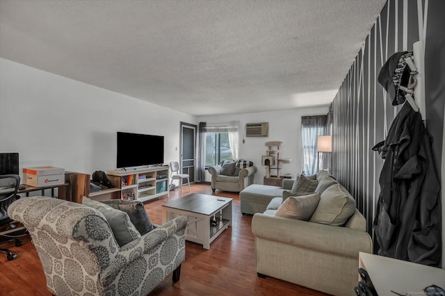 34 Woodland Dr Unit 34, Cromwell, CT 06416 - living room with a textured ceiling, dark wood finished floors, and a wall mounted AC