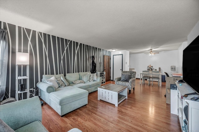 34 Woodland Dr Unit 34, Cromwell, CT 06416 - living room featuring ceiling fan, light wood-style flooring, and a textured ceiling