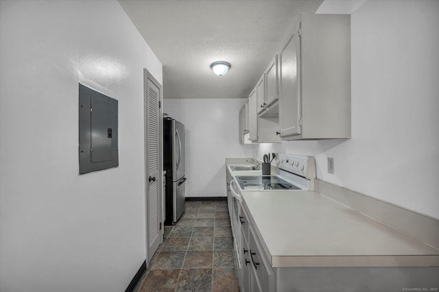 34 Woodland Dr Unit 34, Cromwell, CT 06416 - kitchen with electric panel, white range with electric cooktop, freestanding refrigerator, stone finish floors, and light countertops