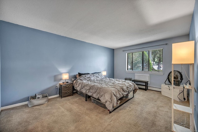 34 Woodland Dr Unit 34, Cromwell, CT 06416 - bedroom with a textured ceiling, carpet floors, and a baseboard radiator