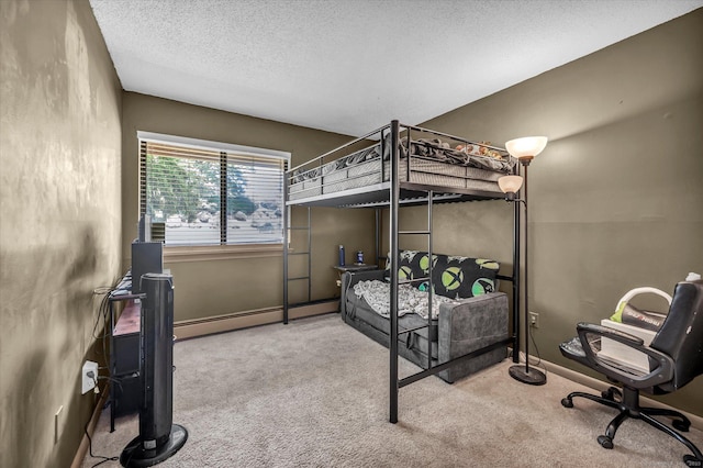34 Woodland Dr Unit 34, Cromwell, CT 06416 - bedroom with carpet, a baseboard heating unit, and a textured ceiling