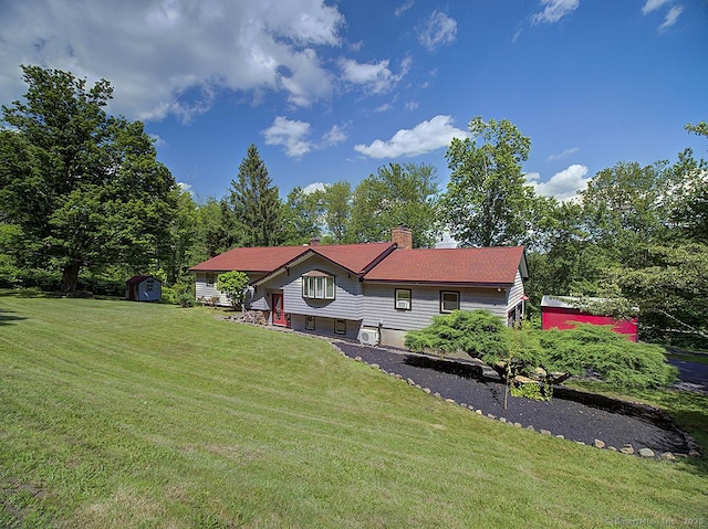 481 Gaylord Mountain Rd, Hamden, CT 06518 - view of front of house featuring a storage shed, a chimney, and a front yard