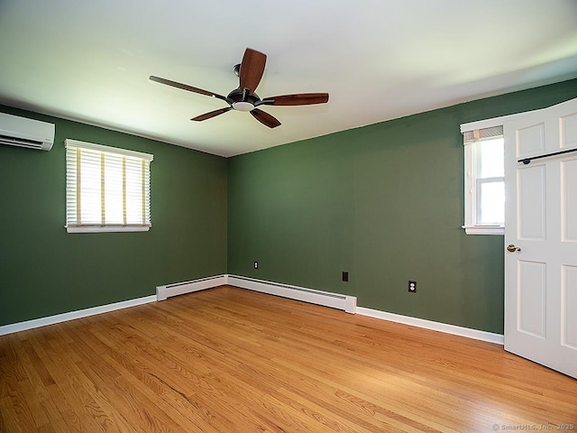 481 Gaylord Mountain Rd, Hamden, CT 06518 - spare room with a baseboard heating unit, ceiling fan, an AC wall unit, and light wood-style floors