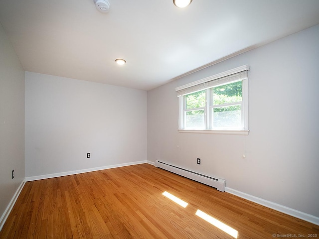 481 Gaylord Mountain Rd, Hamden, CT 06518 - unfurnished room with a baseboard heating unit, a smoke detector, and wood finished floors