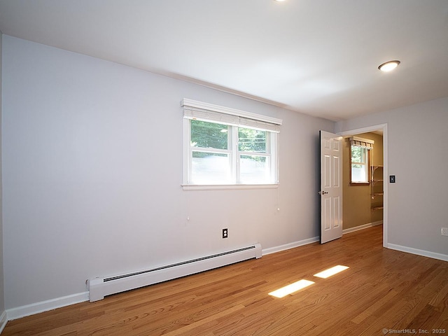481 Gaylord Mountain Rd, Hamden, CT 06518 - empty room featuring a baseboard heating unit and wood finished floors