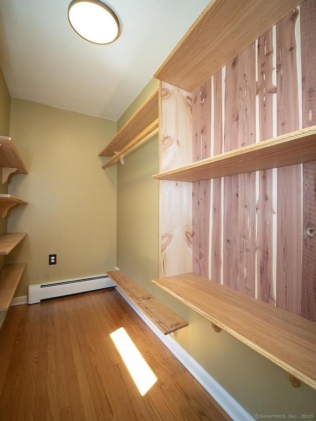 481 Gaylord Mountain Rd, Hamden, CT 06518 - walk in closet with a baseboard heating unit and wood finished floors