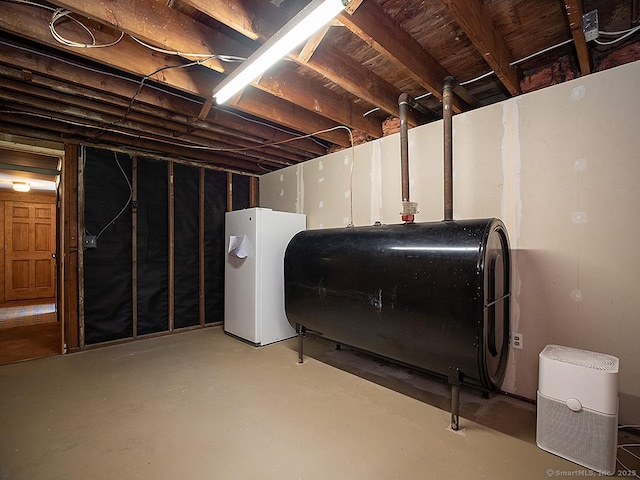 481 Gaylord Mountain Rd, Hamden, CT 06518 - unfinished below grade area featuring oil tank and freestanding refrigerator