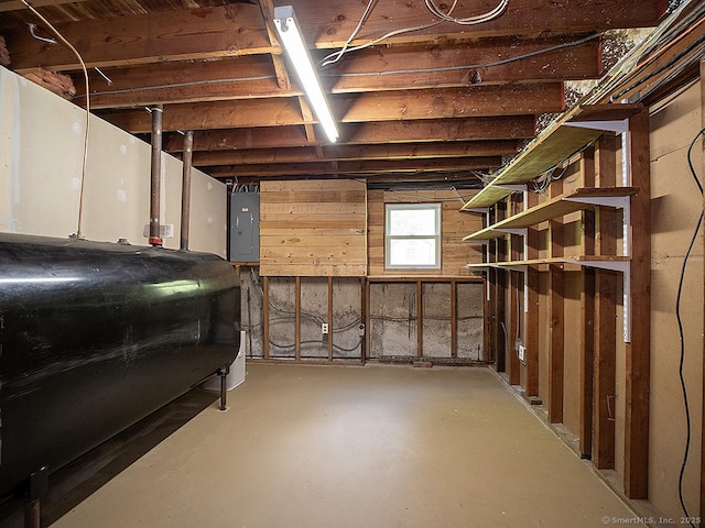 481 Gaylord Mountain Rd, Hamden, CT 06518 - basement with oil tank, electric panel, and wood walls