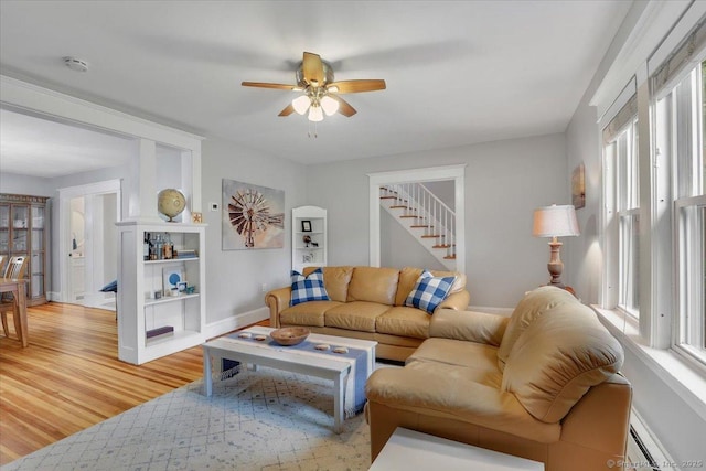146 Summit St, Manchester, CT 06040 - living area with ceiling fan, light wood-type flooring, a baseboard radiator, and stairway
