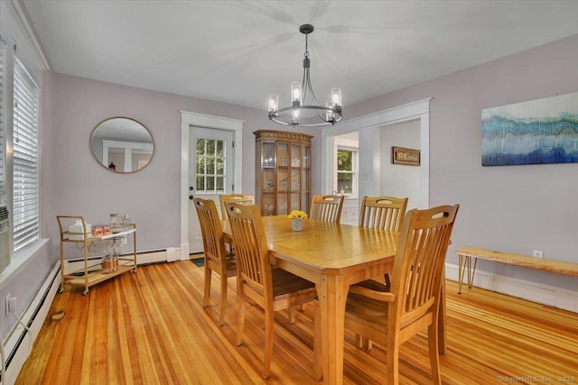 146 Summit St, Manchester, CT 06040 - dining space featuring baseboard heating, a chandelier, light wood finished floors, and plenty of natural light