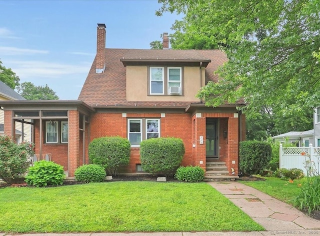 146 Summit St, Manchester, CT 06040 - view of front facade featuring brick siding, stucco siding, a chimney, and a shingled roof