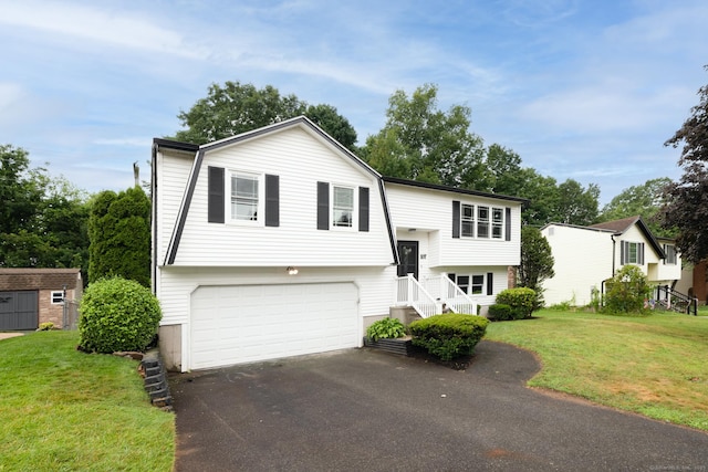 107 Meetinghouse Rdg, Meriden, CT 06450 - split foyer home featuring an attached garage, driveway, and a front lawn