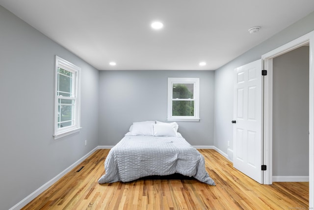 107 Meetinghouse Rdg, Meriden, CT 06450 - bedroom featuring light wood finished floors, multiple windows, and recessed lighting
