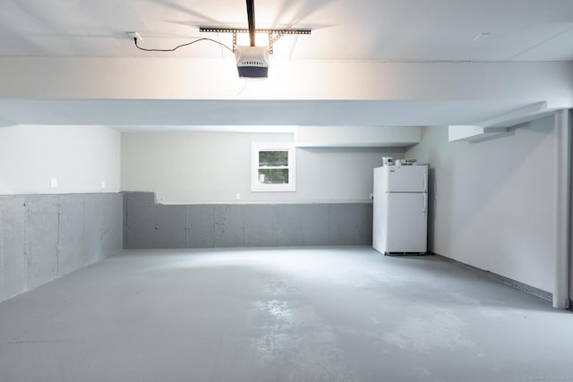 107 Meetinghouse Rdg, Meriden, CT 06450 - garage with freestanding refrigerator and a garage door opener