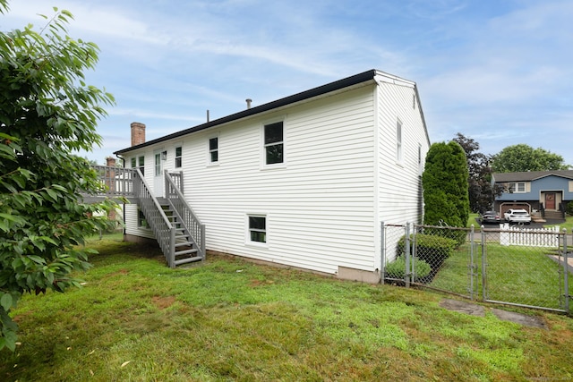 107 Meetinghouse Rdg, Meriden, CT 06450 - back of house with stairs, a wooden deck, and a chimney