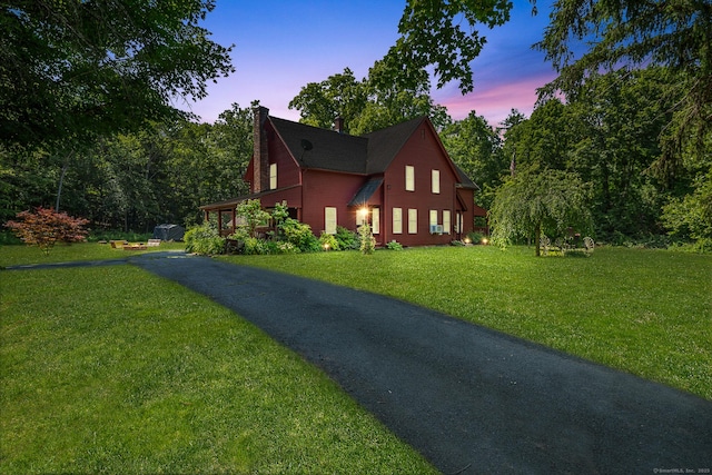 285 E St, Stafford, CT 06076 - view of home's exterior with a chimney and a lawn