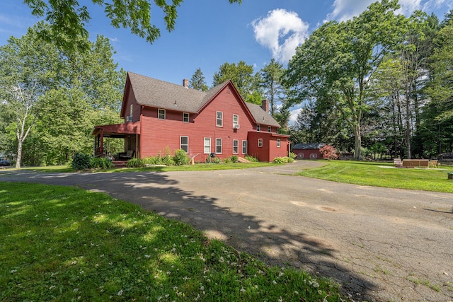 285 E St, Stafford, CT 06076 - view of property exterior with a chimney and a lawn