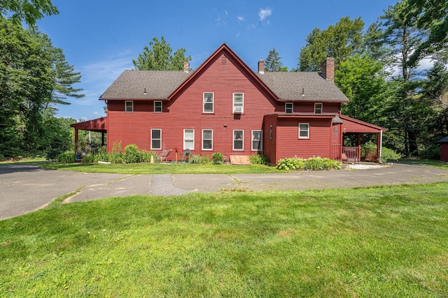 285 E St, Stafford, CT 06076 - view of property exterior featuring a chimney and a yard