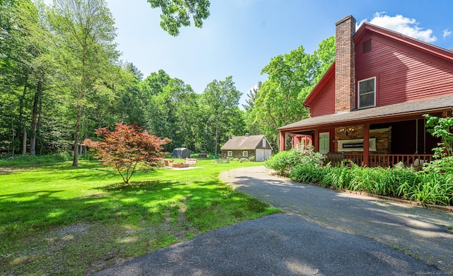 285 E St, Stafford, CT 06076 - view of green lawn featuring covered porch and driveway