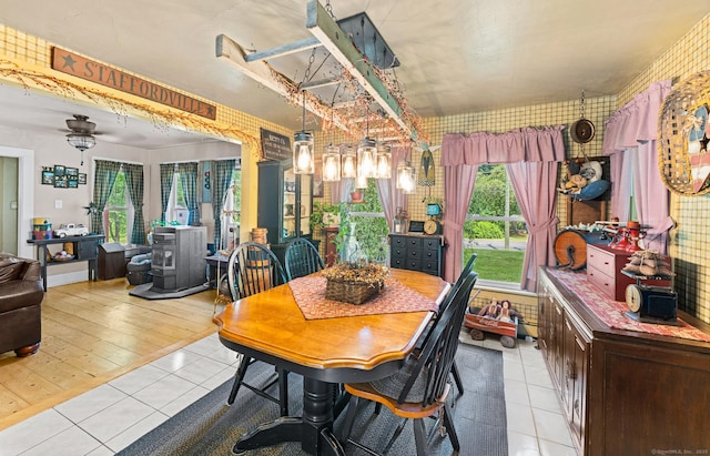 285 E St, Stafford, CT 06076 - dining room featuring a wood stove and light tile patterned floors
