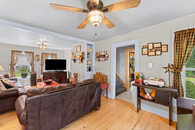 285 E St, Stafford, CT 06076 - living room featuring light wood finished floors, plenty of natural light, and ceiling fan