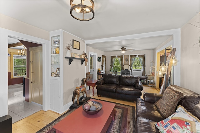 285 E St, Stafford, CT 06076 - living room featuring a chandelier, light wood-style flooring, and ceiling fan
