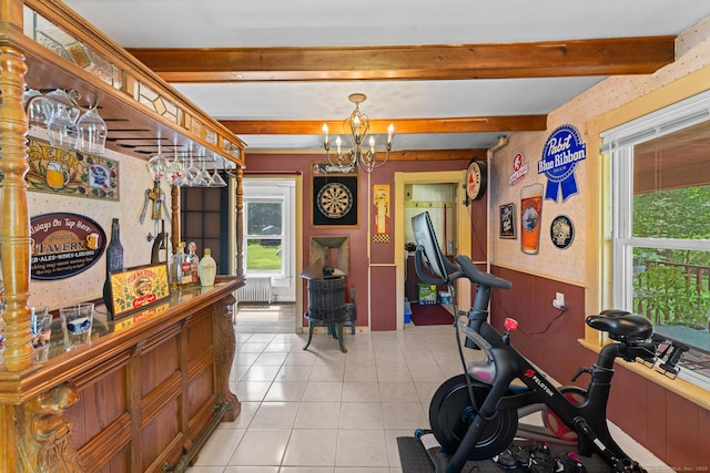 285 E St, Stafford, CT 06076 - exercise room featuring wainscoting, healthy amount of natural light, light tile patterned floors, and a chandelier