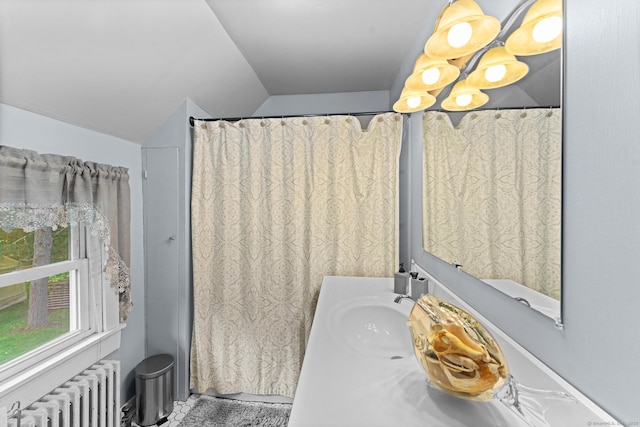 285 E St, Stafford, CT 06076 - bathroom with radiator, vaulted ceiling, and vanity