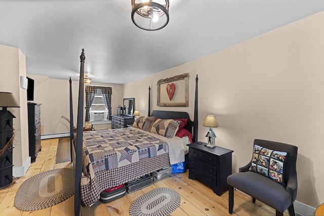 285 E St, Stafford, CT 06076 - bedroom with a baseboard radiator, wood-type flooring, and cooling unit