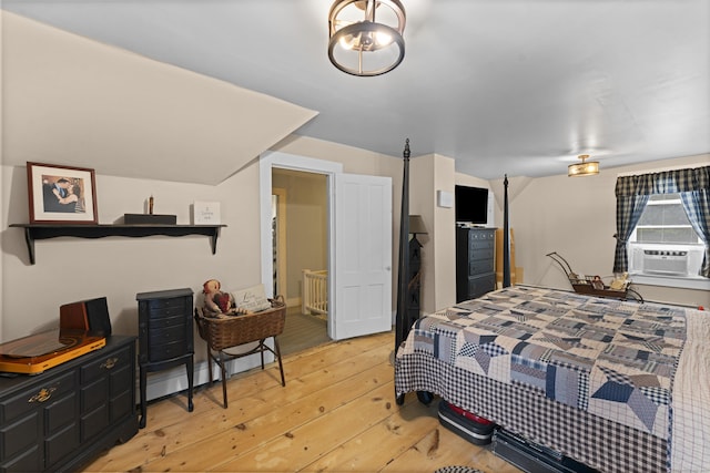 285 E St, Stafford, CT 06076 - bedroom with light wood-style floors and cooling unit