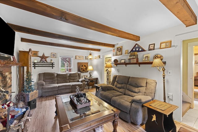 285 E St, Stafford, CT 06076 - living area with beam ceiling and light wood-style floors