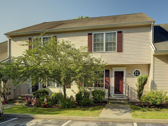 128 Briar Ln Unit 128, Norwich, CT 06360 - view of front of home with roof with shingles and uncovered parking