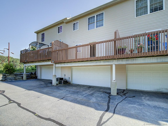 128 Briar Ln Unit 128, Norwich, CT 06360 - back of house with a garage