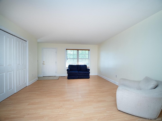 128 Briar Ln Unit 128, Norwich, CT 06360 - living area with light wood-type flooring and baseboards