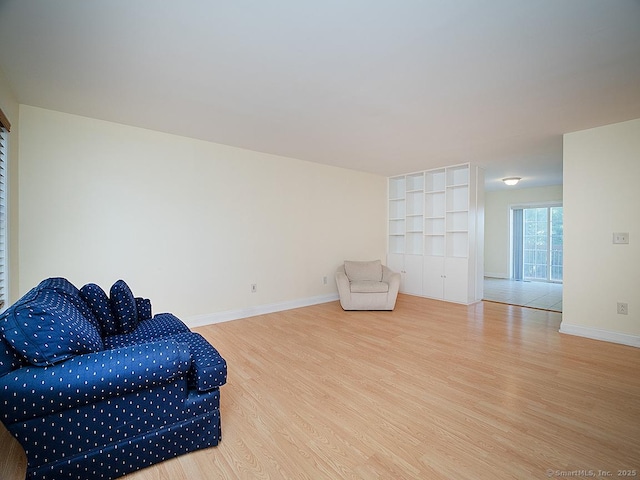 128 Briar Ln Unit 128, Norwich, CT 06360 - living area featuring wood finished floors and baseboards