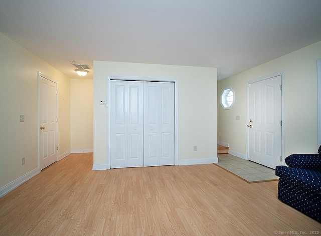128 Briar Ln Unit 128, Norwich, CT 06360 - bedroom featuring light wood-style floors and a closet