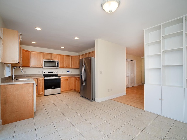 128 Briar Ln Unit 128, Norwich, CT 06360 - kitchen with appliances with stainless steel finishes, light tile patterned floors, recessed lighting, and light countertops