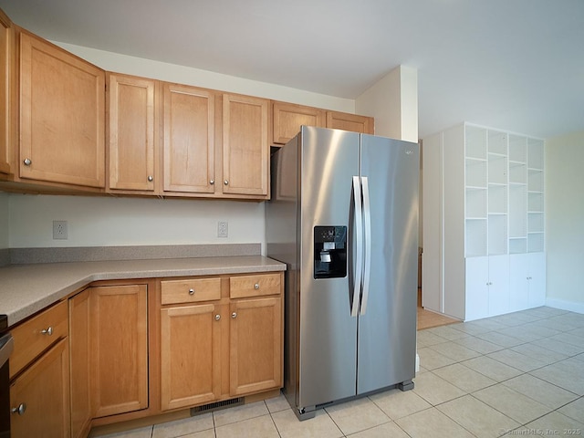 128 Briar Ln Unit 128, Norwich, CT 06360 - kitchen with stainless steel refrigerator with ice dispenser, light tile patterned floors, and light countertops