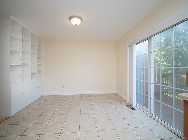 128 Briar Ln Unit 128, Norwich, CT 06360 - spare room featuring baseboards and light tile patterned flooring