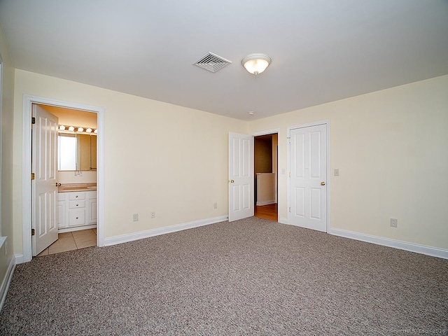 128 Briar Ln Unit 128, Norwich, CT 06360 - unfurnished bedroom with light carpet and connected bathroom
