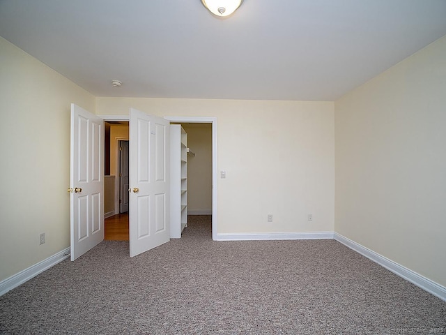 128 Briar Ln Unit 128, Norwich, CT 06360 - unfurnished bedroom featuring carpet floors and baseboards