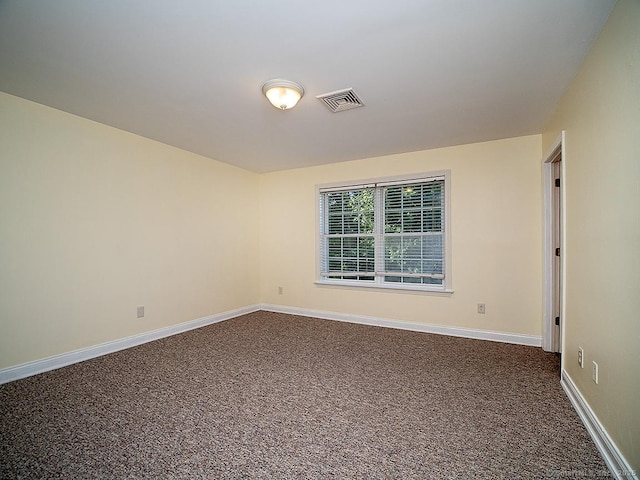 128 Briar Ln Unit 128, Norwich, CT 06360 - empty room featuring dark carpet and baseboards
