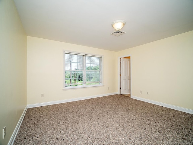 128 Briar Ln Unit 128, Norwich, CT 06360 - empty room featuring dark colored carpet and baseboards