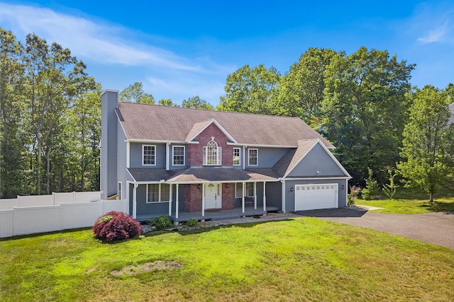 5 Evas Ter, Wolcott, CT 06716 - view of front of house with a chimney, covered porch, driveway, and a garage