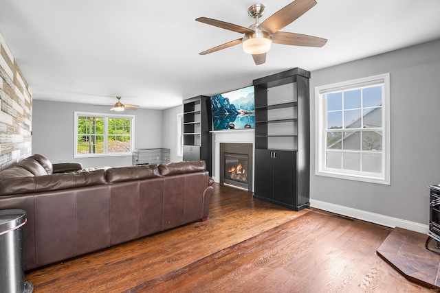 5 Evas Ter, Wolcott, CT 06716 - living area with a ceiling fan, a glass covered fireplace, and wood finished floors