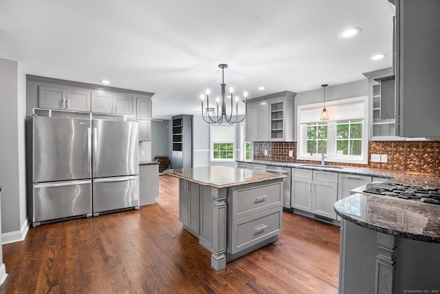 5 Evas Ter, Wolcott, CT 06716 - kitchen with appliances with stainless steel finishes, gray cabinetry, tasteful backsplash, dark wood-style flooring, and dark stone countertops