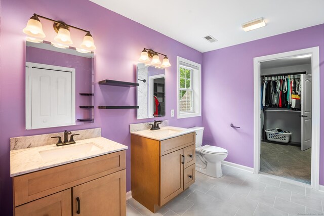 5 Evas Ter, Wolcott, CT 06716 - full bathroom with two vanities, tile patterned flooring, and a walk in closet