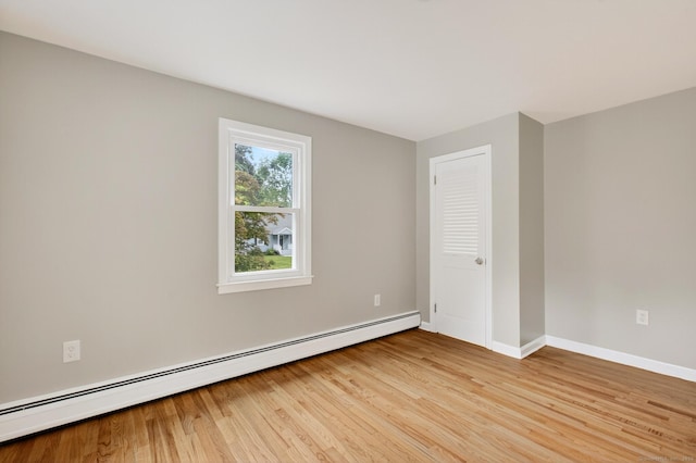 29 Bradford Dr, Windsor, CT 06095 - unfurnished room featuring a baseboard heating unit and light wood finished floors